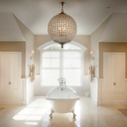 Master bath featuring small bathtub in large open space Bethesda, MD