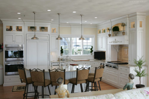 White rock painted cabinets, semicircle island, range, and ovens Old Saybrook, CT