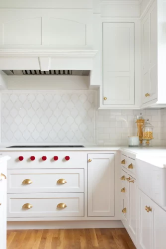 brushed brass hardware on white kitchen cabinets