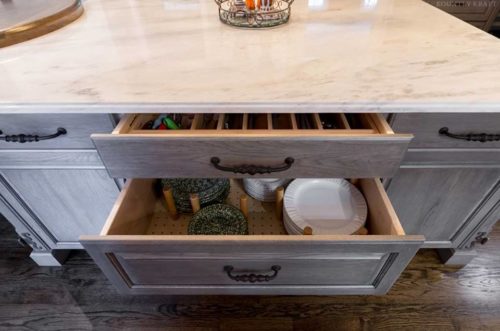 Kountry kraft cabinet storage ideas include drawers with plate organizers to avoid broken or cracked dishes