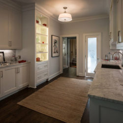 White cabinetry, counter with sink, and liquor bar Laurel Hollow, NY