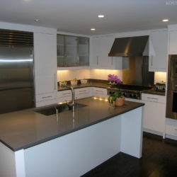 Modern white kitchen cabinetry and sleek kitchen island New Canaan, CT