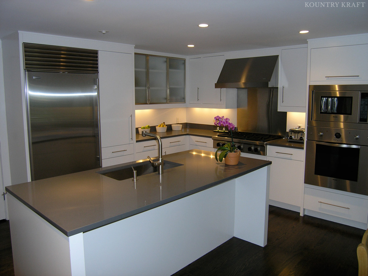 Modern white kitchen cabinetry and sleek kitchen island New Canaan, CT