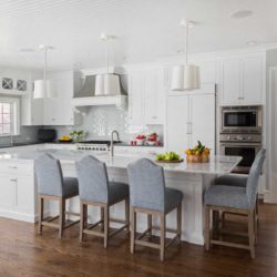 Kitchen featuring island with five chairs, oven, range, and Chantilly Lace Cabinets Villanova, PA