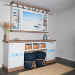 Coast themed entertainment center with numerous features and accent pieces