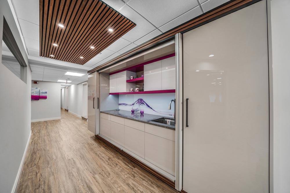 Cabinets in a commercial break room in a local office space with key features