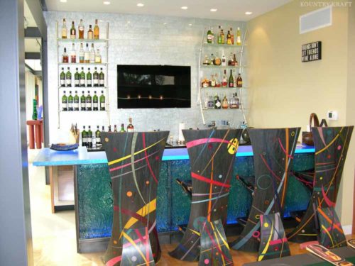 Bar and billard room with wine shelves, colorful chairs, and flat screen Malvern, PA