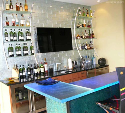 Contemporary bar with wine shelves, wine cooler, and flat screen Malvern, PA
