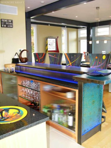 Contemporary bar with glass light up countertop and colorful chairs Malvern, PA