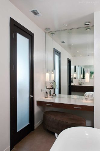View of door and vanity of a contemporary bathroom Norcross, GA