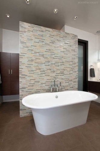 Contemporary bathroom with a freestanding bathtub in front of a matchstick wall Norcross, GA