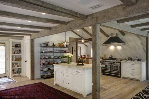 Country kitchen with small island, red carpet, shelves, counters, and range Montecito, CA