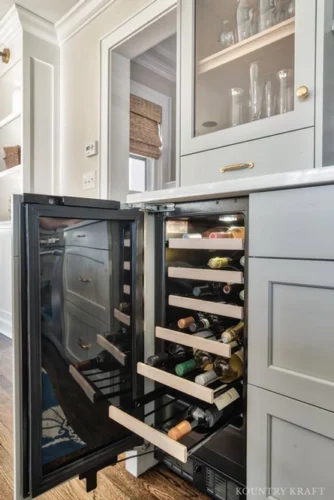 Coventry Gray Kitchen Cabinets disguise a Wine Refrigerator in Chatham, New Jersey