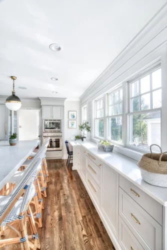 White and Gray Kitchen Cabinets with Brass Hardware for a kitchen in Chatham, New Jersey