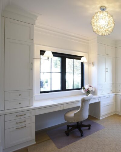 Built-in desk wall with sconces and black-trimmed windows; custom bedroom cabinets in Annapolis MD.