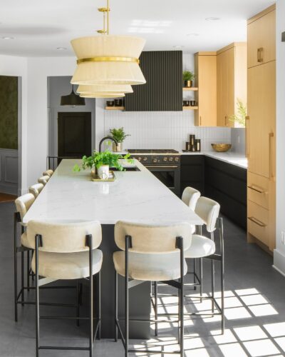 Custom kitchen cabinets Knoxville TN – portrait view of kitchen showing pendant lighting and cabinetry contrast.