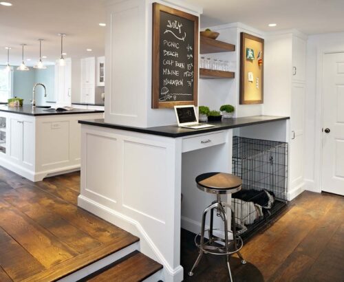 Family command center with chalkboard, corkboard, walnut floating shelves, and custom cabinetry in New Canaan CT kitchen