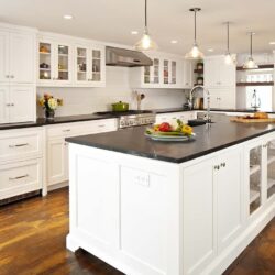 New Canaan CT kitchen remodel with custom white shaker cabinets, large island, pendant lights, and soapstone countertops.