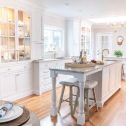 White kitchen remodel Cheshire CT with dual islands, custom cabinetry, and Taj Mahal quartzite for timeless style and function.