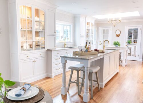White kitchen remodel Cheshire CT with dual islands, custom cabinetry, and Taj Mahal quartzite for timeless style and function.
