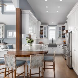 Custom white kitchen remodel Avalon NJ with Kountry Kraft cabinetry, hickory accents, and a wet bar designed for coastal living.