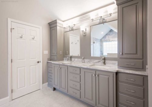 Bathroom with custom graystone painted cabinets and dual sinks with a mirror each Wyomissing, PA