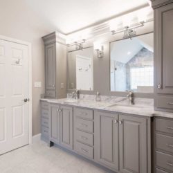 Bathroom with custom gray cabinets and dual sinks with a mirror each Wyomissing, PA
