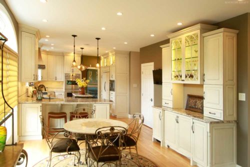 Kitchen with round table, four chairs, and white cabinets Chester Springs, PA