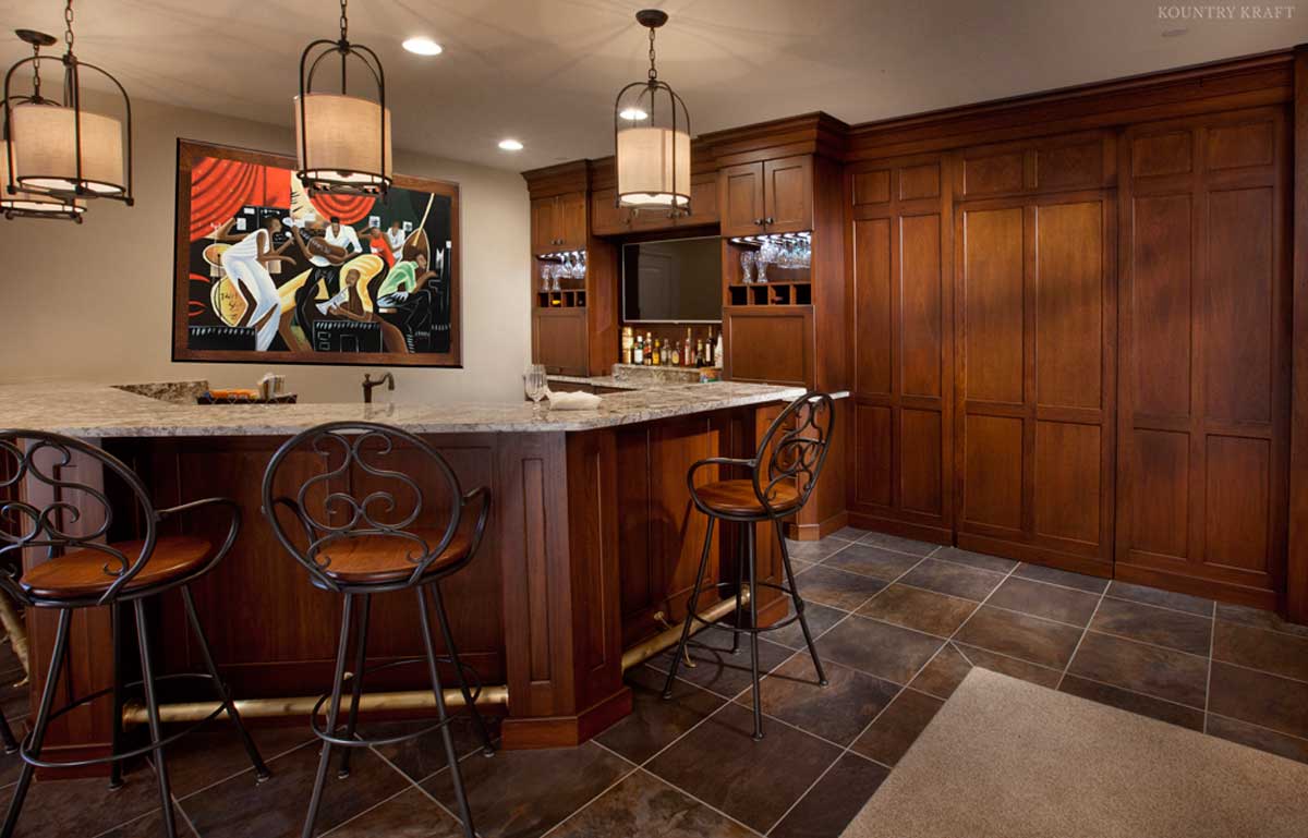 Full view of bar with three seats, cabinets, and painting in background Ellicott City, MD