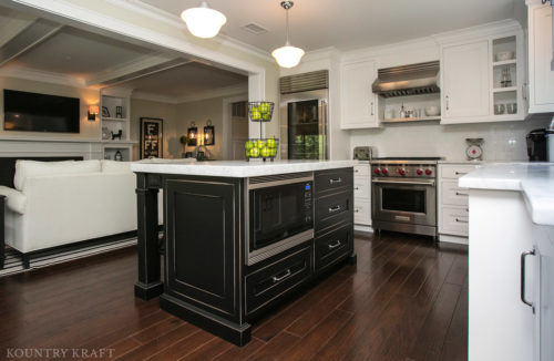 Custom cabinetry including black kitchen with built in speed oven and Wolf range Chatham, NJ