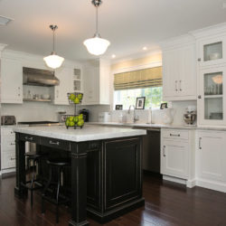 Alpine white painted custom cabinetry and black kitchen island with stools Chatham, NJ