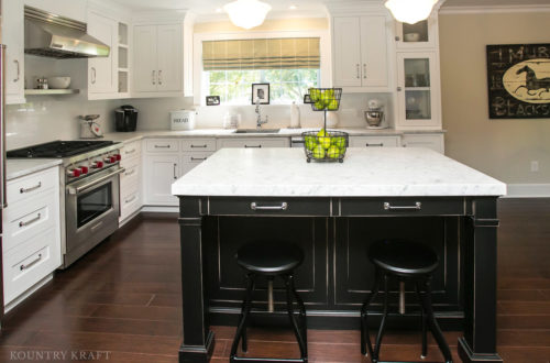 White custom cabinetry and black kitchen island with stools and Wolf range Chatham, NJ