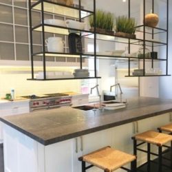 Kitchen island with stools and overhanging shelves Southampton, NY