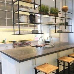 Kitchen island with stools and overhanging shelves Southampton, NY