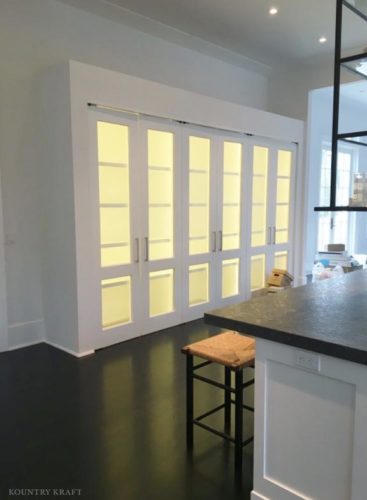 Illuminated doors in custom white kitchen Southampton, NY