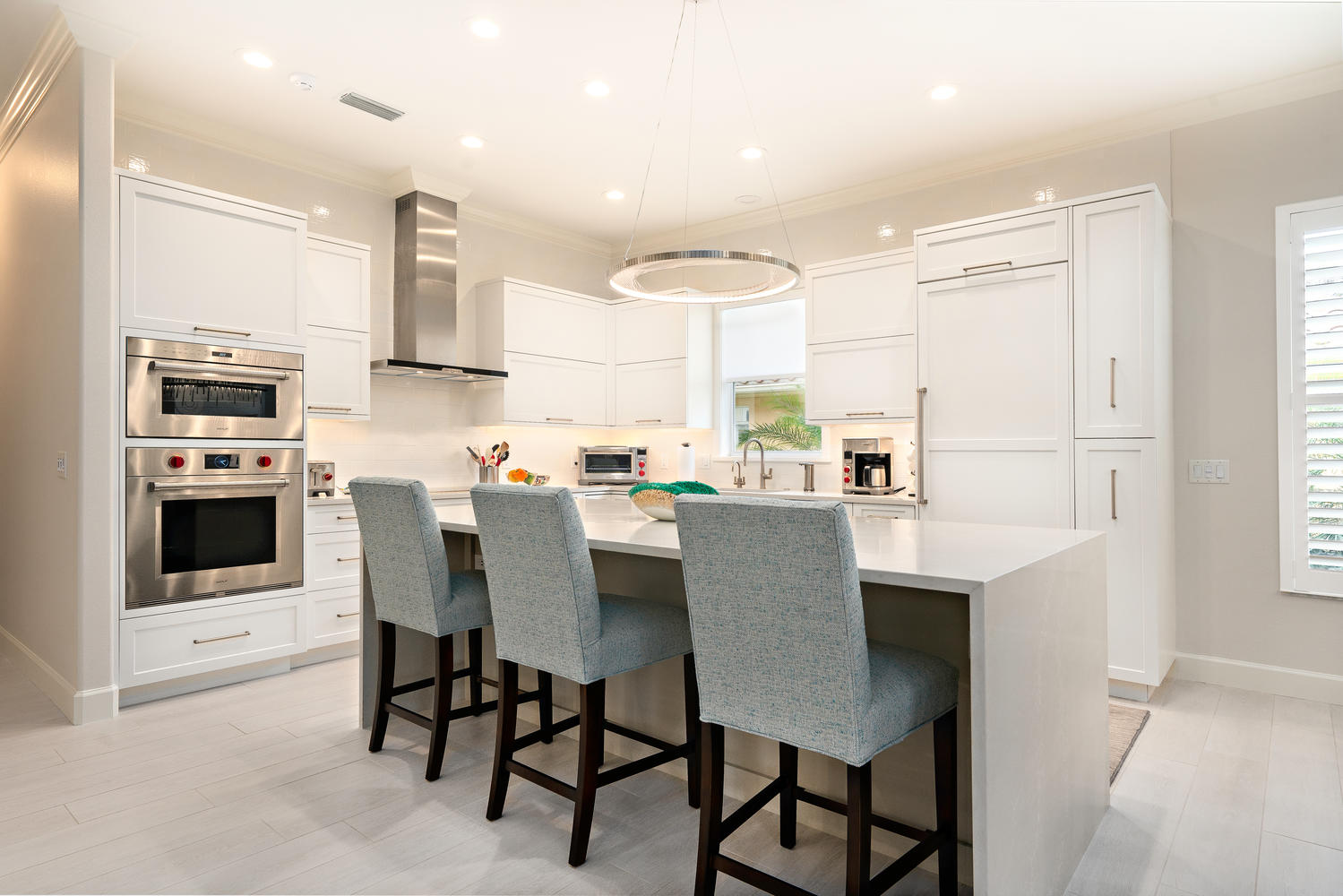 Contemporary Kitchen with Decorators White Cabinets in Venice, Florida