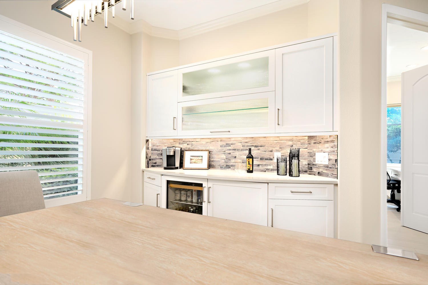 Wet Bar with Decorators White Cabinets and Glass Doors 