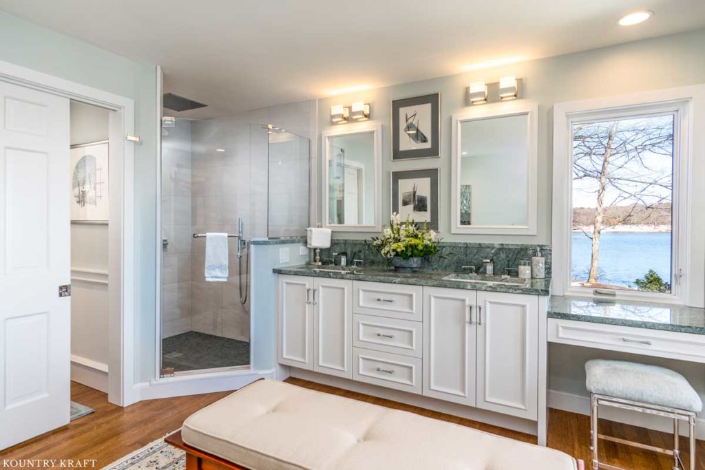 Decorators White Bathroom Cabinets for a double vanity and makeup station in Winchester, Massachusetts