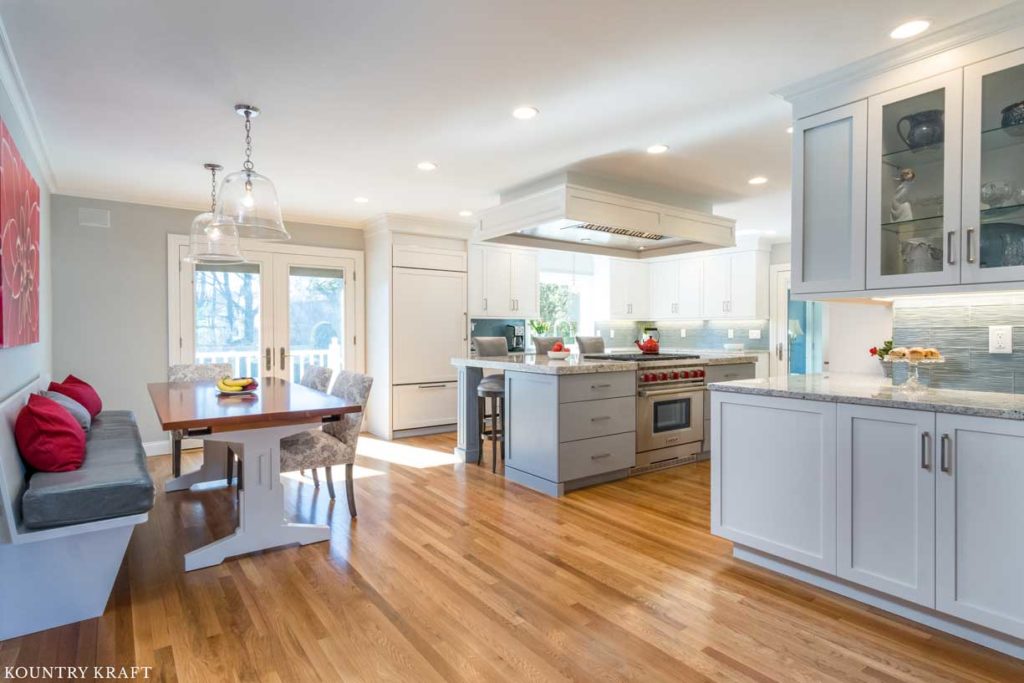 Decorators White Cabinets and Benjamin Moore Shadow Gray Painted Kitchen Island for a home in Marblehead, Massachusetts