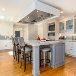 Decorators White Cabinets and Benjamin Moore Shadow Gray Kitchen Island for a home located in Marblehead, Massachusetts