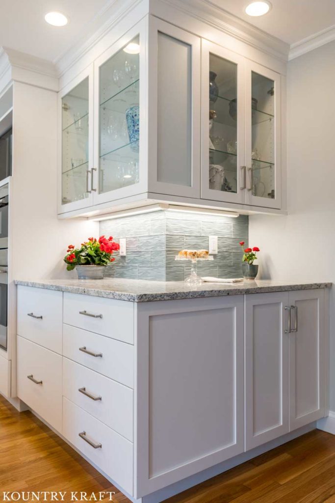 Custom Wet Bar Cabinets crafted to wrap a corner in a kitchen located in Marblehead, Massachusetts