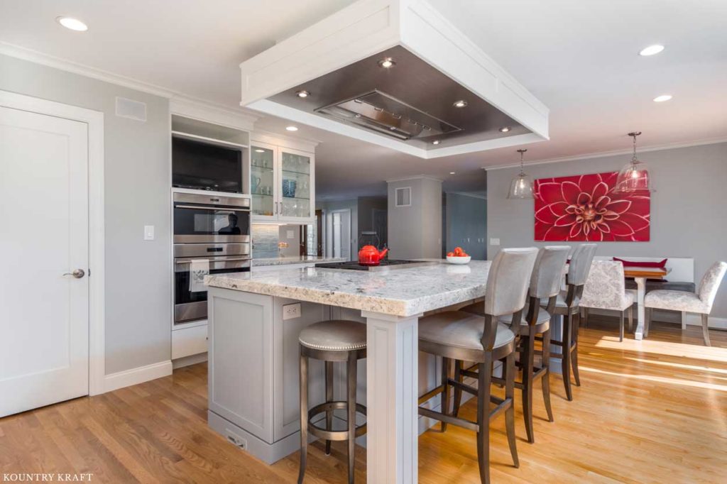 Custom Kitchen Island Range Hood includes a Stainless Steel Insert for Air Filtration