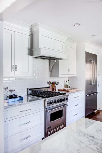 a designers dream kitchen must include a hidden range hood