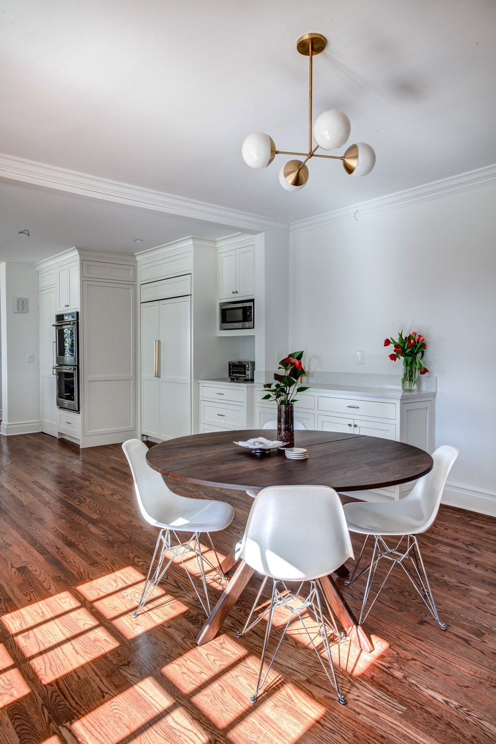 Dining Room Storage Cabinets are an extension from the kitchen in this transitional home