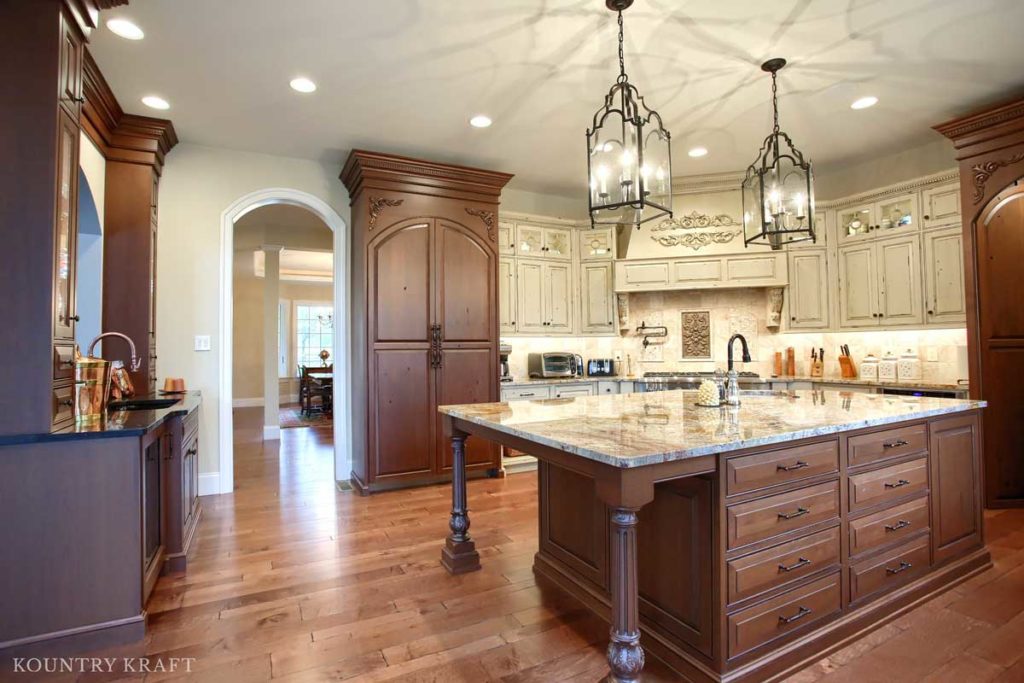 Rustic Cherry Island and Century Vanilla Bean Distressed Kitchen Cabinets for a kitchen in Mohnton, PA