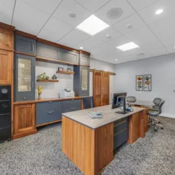 Executive office cabinetry with wrought iron paint finish and natural walnut cabinets in Newmanstown, PA