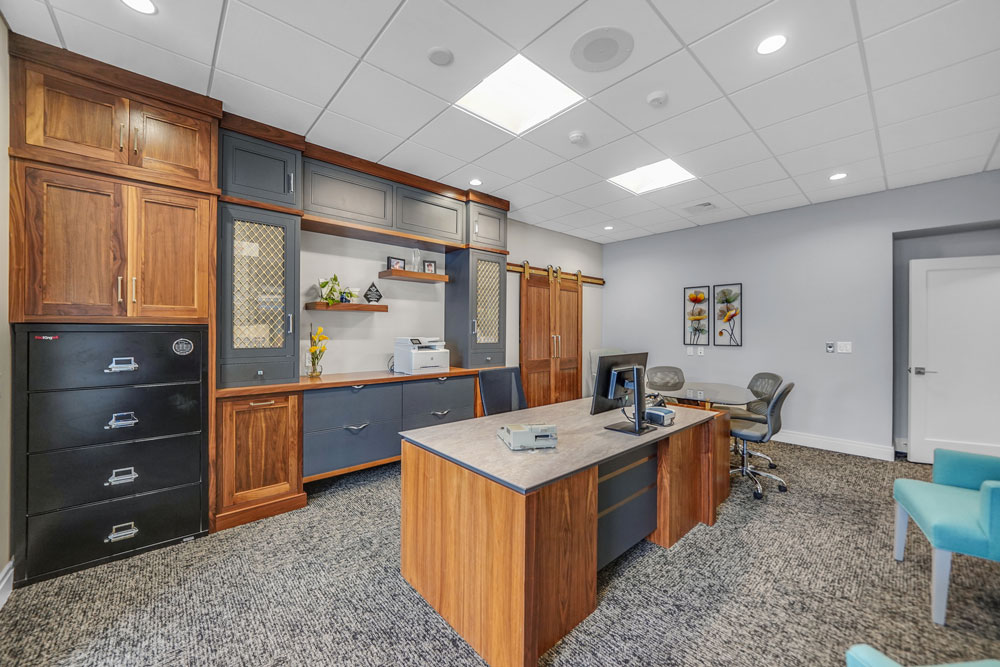 Executive office cabinetry with wrought iron paint finish and natural walnut cabinets in Newmanstown, PA