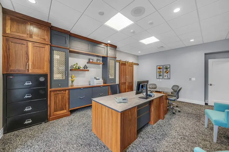 Executive office cabinetry with wrought iron paint finish and natural walnut cabinets in Newmanstown, PA