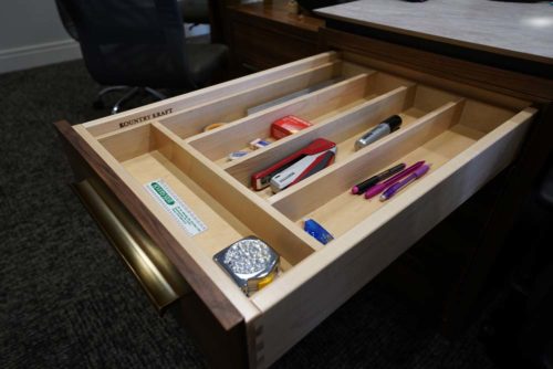 Drawer organizer feature in executive custom cabinetry office