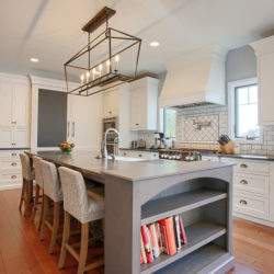 Extra White Kitchen Cabinets with Gray Kitchen Island for farmhouse style home in Sinking Spring, Pennsylvania